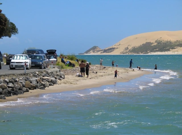 Opononi beach offering fun for family and friends on a hot sunny day. Far North, North Island, New Zealand
