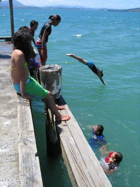 Oponoi wharf is a great swimming place during those hot days. Far North, North Island, New Zealand